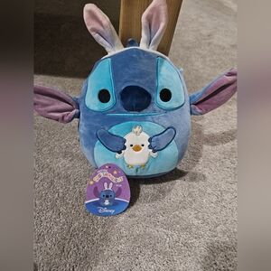 Stitch holding a chick